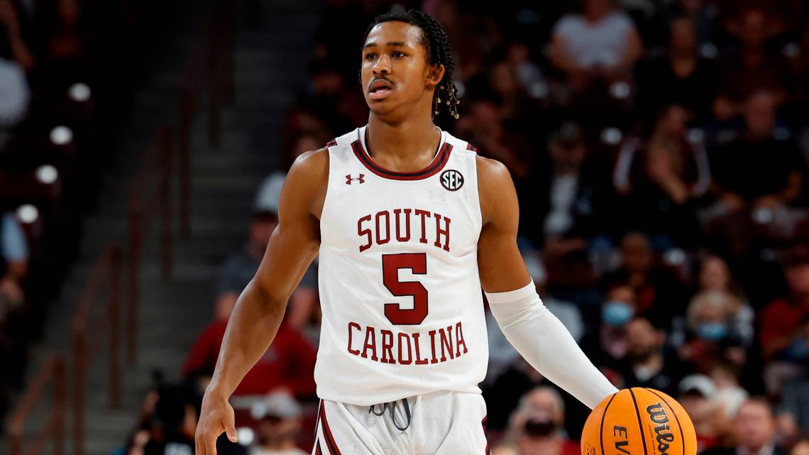 Guard Meechie Johnson taking the ball up the court